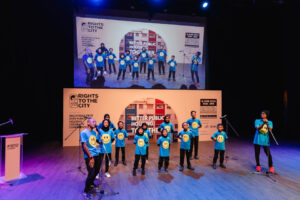 Hatta Midy and children from PPR Kg. Baru HICOM performing "Kita Untuk Kita"